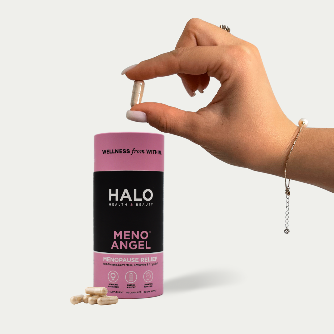 Hand holding a capsule of  Halo Meno Angel - Menopause Relief supplement 