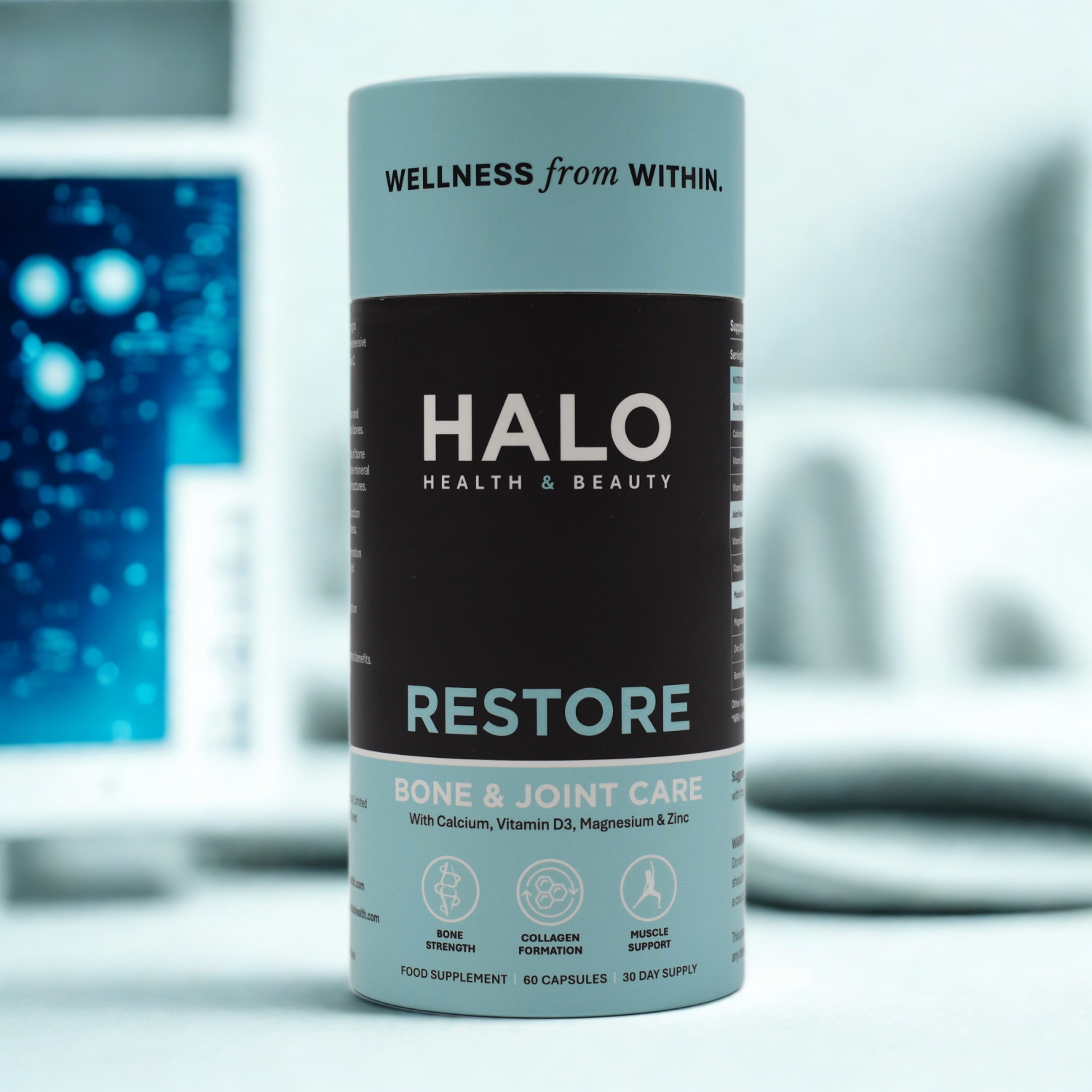 Halo Health & Beauty Restore supplement canister on a blurred background