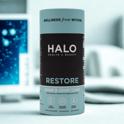 Halo Health & Beauty Restore supplement canister on a blurred background